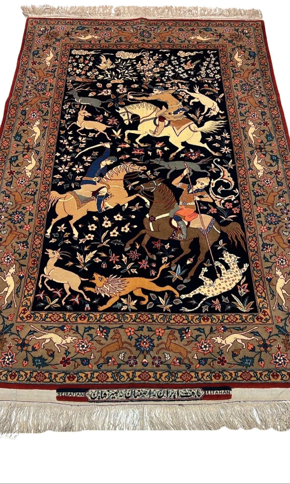 Close-up view of the Seirafian Hunting Scene rug, showcasing intricate hand-knotted silk and wool craftsmanship.